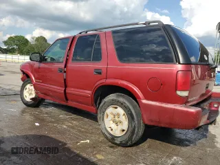 2000 Chevrolet Blazer LT z VIN 1GNDT13WXY2287496, wystawiony jako Copart lot #58950255 z przebiegiem 245 512 mil mil oraz Szkoda całkowita • Salvage title. Historia ofert i sprzedaży dostępna na DreamBid. Obrazek 2.