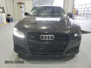 2017 Audi A8 Sport z VIN WAU43AFD4HN020515, wystawiony jako Copart lot #44953055 z przebiegiem 115 422 mil mil oraz Szkody całkowita. Historia ofert i sprzedaży dostępna na DreamBid. Obrazek 5.