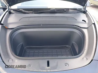 2024 Tesla Model Y with VIN 7SAYGDED9RA321373, listed as a IAAI auction lot 42228491 with 6,452 mi miles and . Bid and sale history available at DreamBid. Image 10.