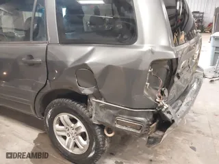2005 Honda Pilot EX-L with RES with VIN 2HKYF18655H521175, listed as a IAAI auction lot 41490812 with 357,033 mi miles. Bid and sale history available at carsss.com. Image 6.