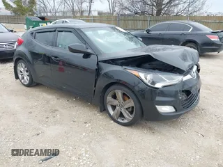 2013 Hyundai Veloster w/Gray Int with VIN KMHTC6AD3DU131832, listed as a IAAI auction lot 41954643 with 140,133 mi miles and . Bid and sale history available at DreamBid. Image 1.