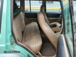 1999 Jeep Cherokee SE with VIN 1J4FF28SXXL641556, listed as a Copart auction lot 62605065 with Not provided miles and Salvage title. Bid and sale history available at DreamBid. Image 11.