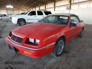 1990 Chrysler LeBaron z VIN 1C3XJ45J9LG405682, wystawiony jako Copart lot #48690985 z przebiegiem 75 714 mil mil oraz Tytuł czysty. Historia ofert i sprzedaży dostępna na DreamBid. Obrazek 1.