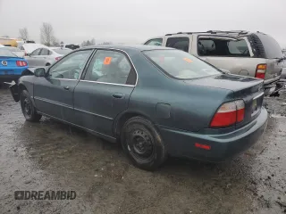 1996 Honda Accord Value with VIN 1HGCD5693TA266021, listed as a Copart auction lot 86699844 with 237,152 mi miles and Salvage Title. Bid and sale history available at DreamBid. Image 2.