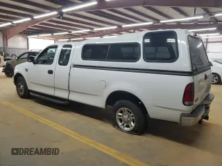 2001 Ford F-150 XL with VIN 1FTRX17L51NB25752, listed as a Copart auction lot 48721235 with 179,941 mi miles and Salvage title. Bid and sale history available at DreamBid. Image 2.