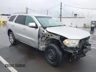 2013 Dodge Durango Crew z VIN 1C4RDJDGXDC637572, wystawiony jako IAAI lot #41922757 z przebiegiem 110 941 mil mil oraz . Historia ofert i sprzedaży dostępna na DreamBid. Obrazek 1.