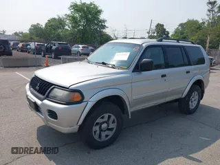 2003 Mitsubishi Montero XLS z VIN JA4MT31R33J048723, wystawiony jako IAAI lot #42439332 z przebiegiem 185 593 mil mil oraz . Historia ofert i sprzedaży dostępna na DreamBid. Obrazek 2.