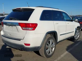 2012 Jeep Grand Cherokee Laredo with VIN 1C4RJFAG5CC310893, listed as a IAAI auction lot 41695279 with 136,821 mi miles. Bid and sale history available at carsss.com. Image 4.