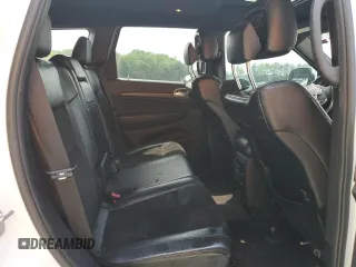 2018 Jeep Grand Cherokee Altitude with VIN 1C4RJFAGXJC122688, listed as a Copart auction lot 61290525 with 106,671 mi miles and Salvage title. Bid and sale history available at DreamBid. Image 11.