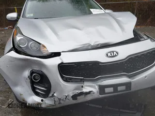 2018 Kia Sportage EX z VIN KNDPNCAC8J7309766, wystawiony jako IAAI lot #42219243 z przebiegiem 90 745 mil mil oraz . Historia ofert i sprzedaży dostępna na DreamBid. Obrazek 6.