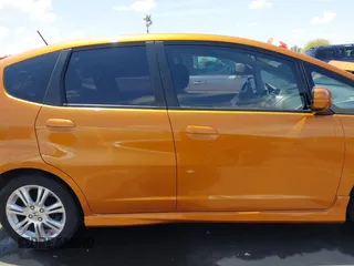 2009 Honda Fit Sport z VIN JHMGE88459S053122, wystawiony jako IAAI lot #42195267 z przebiegiem 47 349 mil mil oraz . Historia ofert i sprzedaży dostępna na DreamBid. Obrazek 13.