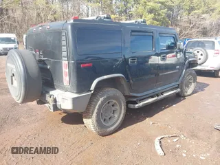 2003 Hummer H2 with VIN 5GRGN23U33H144379, listed as a IAAI auction lot 41452982 with 227,746 mi miles. Bid and sale history available at carsss.com. Image 4.