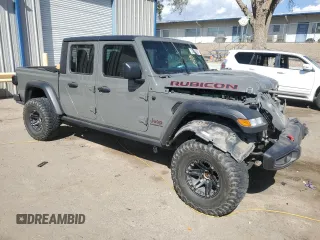 2020 Jeep Gladiator Rubicon with VIN 1C6JJTBG9LL163270, listed as a Copart auction lot 53654005 with 74,744 mi miles and Salvage title. Bid and sale history available at DreamBid. Image 4.