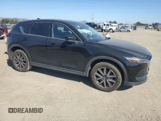 2018 Mazda CX-5 Grand Touring с VIN JM3KFADM2J1310339, выставлен на аукционе Copart как лот 64705245 с пробегом 63 927 миль миль и Списание • Salvage title. История ставок и продаж доступна на DreamBid. Изображение 4.