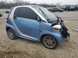 2015 Smart fortwo Passion z VIN WMEEJ3BA9FK791881, wystawiony jako Copart lot #43876595 z przebiegiem 56 699 mil mil oraz Szkody całkowita. Historia ofert i sprzedaży dostępna na DreamBid. Obrazek 4.