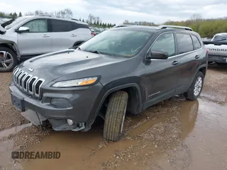 2014 Jeep Cherokee Altitude with VIN 1C4PJMCB2EW181848, listed as a IAAI auction lot 41638004 with 175,813 mi miles. Bid and sale history available at carsss.com. Image 2.