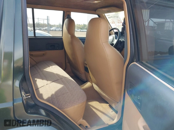 1998 Jeep Cherokee Sport with VIN 1J4FT68S8WL131348, listed as a IAAI auction lot 41912540 with 111,579 mi miles. Bid and sale history available at carsss.com. Image 8.