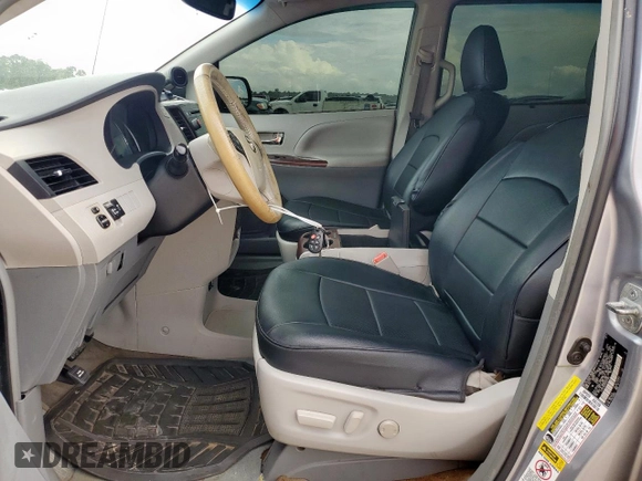 2013 Toyota Sienna XLE AAS with VIN 5TDYK3DC6DS291562, listed as a Copart auction lot 62411965 with 150,505 mi miles and Salvage title. Bid and sale history available at DreamBid. Image 7.