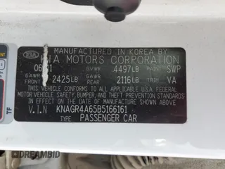 2011 Kia Optima SX z VIN KNAGR4A65B5166161, wystawiony jako Copart lot #56749455 z przebiegiem 213 574 mil mil oraz Szkoda całkowita • Salvage title. Historia ofert i sprzedaży dostępna na DreamBid. Obrazek 13.