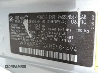 2011 BMW 3 Series 328i xDrive with VIN WBAKF5C5XBE586494, listed as a Copart auction lot 49692595 with 239,048 mi miles and Salvage title. Bid and sale history available at DreamBid. Image 14.