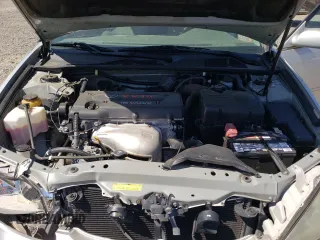 2002 Toyota Camry LE z VIN 4T1BE32KX2U037722, wystawiony jako Copart lot #58482805 z przebiegiem 154 207 mil mil oraz Szkoda całkowita • Salvage title. Historia ofert i sprzedaży dostępna na DreamBid. Obrazek 11.