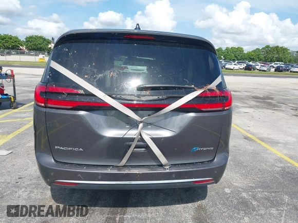 2023 Chrysler Pacifica Hybrid Touring L with VIN 2C4RC1L74PR579782, listed as a IAAI auction lot 42487390 with Not provided miles and . Bid and sale history available at DreamBid. Image 17.