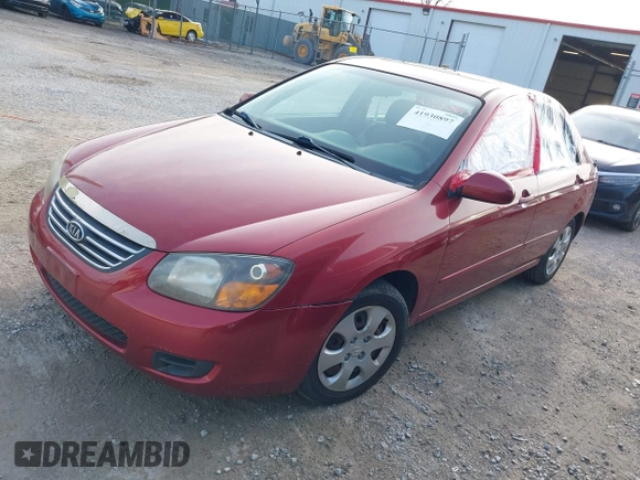 2009 Kia Spectra EX with VIN KNAFE221095634712, listed as a IAAI auction lot 41930897 with 165,185 mi miles. Bid and sale history available at carsss.com. Image 2.