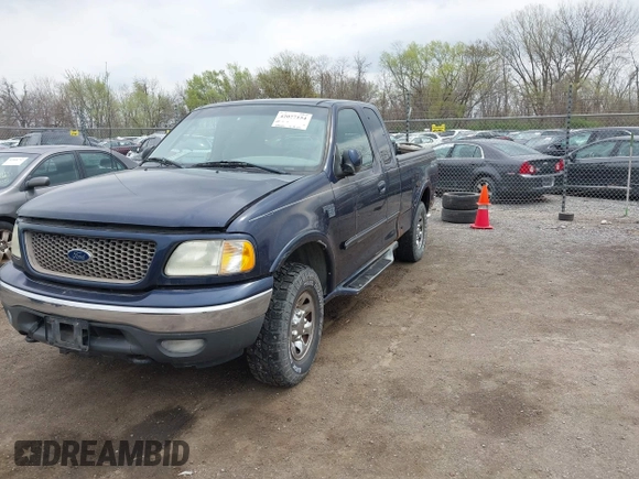 2002 Ford F-150 XL with VIN 2FTPX18L32CA67220, listed as a IAAI auction lot 42077154 with 233,409 mi miles. Bid and sale history available at carsss.com. Image 2.
