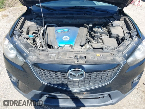2013 Mazda CX-5 Grand Touring with VIN JM3KE4DE6D0127601, listed as a IAAI auction lot 42143558 with 95,719 mi miles and . Bid and sale history available at DreamBid. Image 10.
