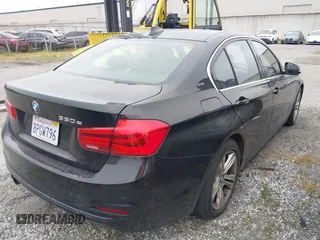 2017 BMW 3 Series 330e iPerformance with VIN WBA8E1C58HK480271, listed as a IAAI auction lot 42039429 with 93,242 mi miles. Bid and sale history available at carsss.com. Image 4.