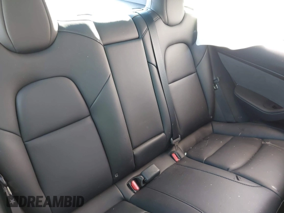 2023 Tesla Model 3 with VIN 5YJ3E1EA2PF582331, listed as a IAAI auction lot 41043858 with 33,601 mi miles and . Bid and sale history available at DreamBid. Image 8.
