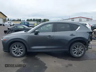 2020 Mazda CX-5 Grand Touring with VIN JM3KFBDM4L0829861, listed as a IAAI auction lot 41826250 with 62,091 mi miles and . Bid and sale history available at carsss.com. Image 15.