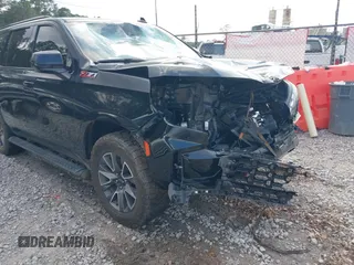 2021 Chevrolet Tahoe Z71 z VIN 1GNSKPKD8MR122190, wystawiony jako IAAI lot #41587419 z przebiegiem 106 828 mil mil oraz . Historia ofert i sprzedaży dostępna na DreamBid. Obrazek 1.