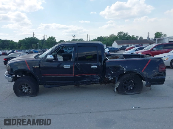 2003 Ford F-150 XLT z VIN 1FTRW08L73KA58913, wystawiony jako IAAI lot #41907277 z przebiegiem 147 294 mil mil oraz . Historia ofert i sprzedaży dostępna na DreamBid. Obrazek 14.