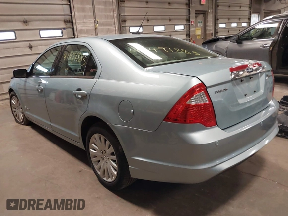 2010 Ford Fusion Hybrid z VIN 3FADP0L34AR276532, wystawiony jako IAAI lot #41491883 z przebiegiem 159 076 mil mil oraz . Historia ofert i sprzedaży dostępna na DreamBid. Obrazek 3.