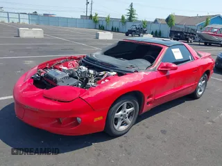 2002 Pontiac Firebird with VIN 2G2FS22K122169318, listed as a IAAI auction lot 40006885 with 115,799 mi miles. Bid and sale history available at carsss.com. Image 2.