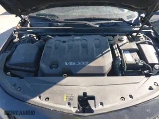 2014 Chevrolet Impala LTZ with VIN 2G1155S31E9105694, listed as a IAAI auction lot 41414595 with 128,828 mi miles. Bid and sale history available at carsss.com. Image 10.