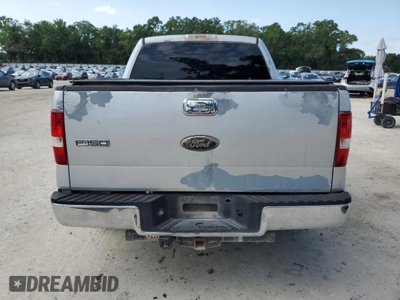 2006 Ford F-150 XLT with VIN 1FTRW12W06KD84579, listed as a Copart auction lot 55090155 with 296,917 mi miles and Salvage Title. Bid and sale history available at DreamBid. Image 6.