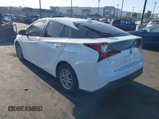 2021 Toyota Prius L Eco with VIN JTDKAMFU0M3149875, listed as a IAAI auction lot 41966010 with 99,542 mi miles. Bid and sale history available at carsss.com. Image 3.