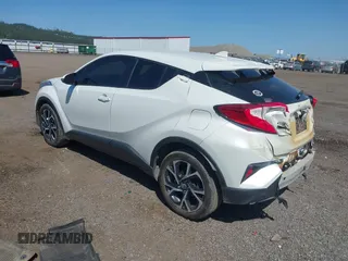 2018 Toyota C-HR XLE z VIN NMTKHMBXXJR041817, wystawiony jako IAAI lot #42174035 z przebiegiem 86 669 mil mil oraz . Historia ofert i sprzedaży dostępna na DreamBid. Obrazek 3.