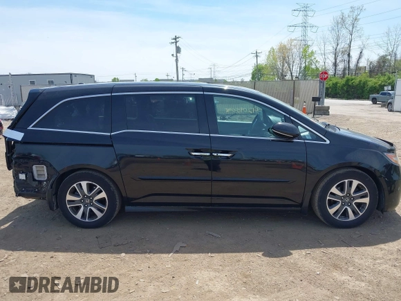2014 Honda Odyssey Touring with VIN 5FNRL5H94EB079518, listed as a IAAI auction lot 42095098 with 141,019 mi miles and . Bid and sale history available at DreamBid. Image 14.