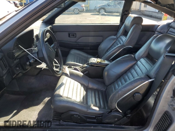 1986 Toyota Supra z VIN JT2MA67L9G0175108, wystawiony jako Copart lot #80793984 z przebiegiem 158 959 mil mil oraz Szkoda całkowita • Salvage title. Historia ofert i sprzedaży dostępna na DreamBid. Obrazek 7.