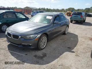 2013 BMW 3 Series 328i xDrive with VIN WBA3B3G56DNR81144, listed as a IAAI auction lot 40620694 with 159,022 mi miles. Bid and sale history available at carsss.com. Image 2.