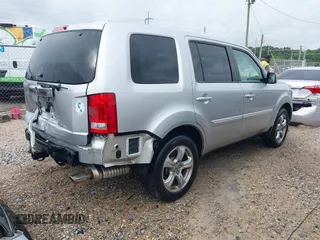 2014 Honda Pilot EX-L with VIN 5FNYF3H73EB011880, listed as a IAAI auction lot 42157396 with 73,881 mi miles and . Bid and sale history available at carsss.com. Image 4.