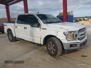 2019 Ford F-150 XL with VIN 1FTEW1E50KFA47687, listed as a IAAI auction lot 42021043 with 129,337 mi miles. Bid and sale history available at carsss.com. Image 6.