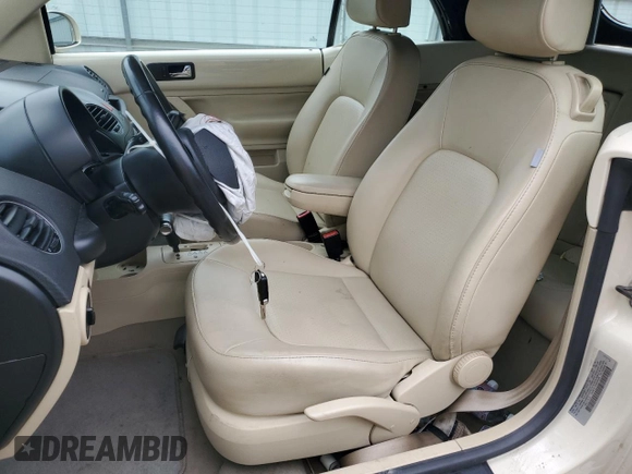 2009 Volkswagen Beetle S with VIN 3VWRF31Y99M409195, listed as a Copart auction lot 55010054 with 99,635 mi miles and Salvage title. Bid and sale history available at DreamBid. Image 7.