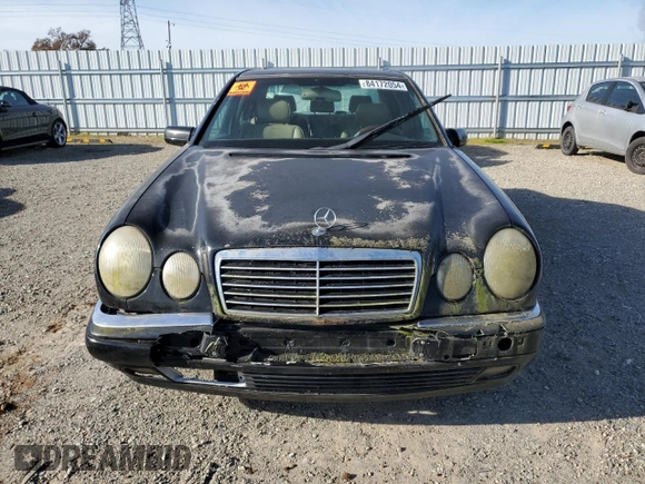 1997 Mercedes-Benz E-Class with VIN WDBJF55F5VJ028552, listed as a Copart auction lot 84172054 with 308,426 mi miles and Clean Title. Bid and sale history available at carsss.com. Image 5.