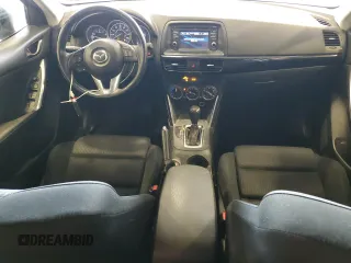 2014 Mazda CX-5 Touring z VIN JM3KE4CY5E0393463, wystawiony jako Copart lot #57776665 z przebiegiem 91 565 mil mil oraz Szkoda całkowita • Salvage title. Historia ofert i sprzedaży dostępna na DreamBid. Obrazek 8.