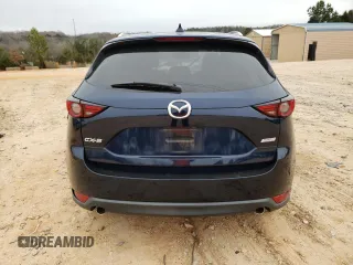 2019 Mazda CX-5 Grand Touring with VIN JM3KFADM0K1596256, listed as a Copart auction lot 86323594 with 118,853 mi miles and Salvage title. Bid and sale history available at DreamBid. Image 6.