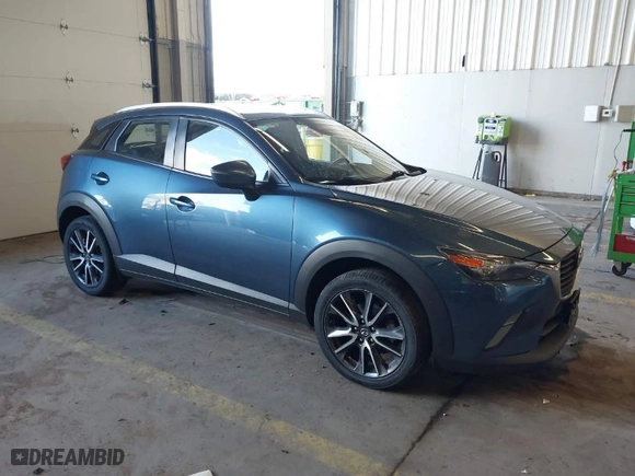 2018 Mazda CX-3 Touring with VIN JM1DKFC78J1323439, listed as a IAAI auction lot 41725784 with 134,055 mi miles. Bid and sale history available at carsss.com. Image 1.